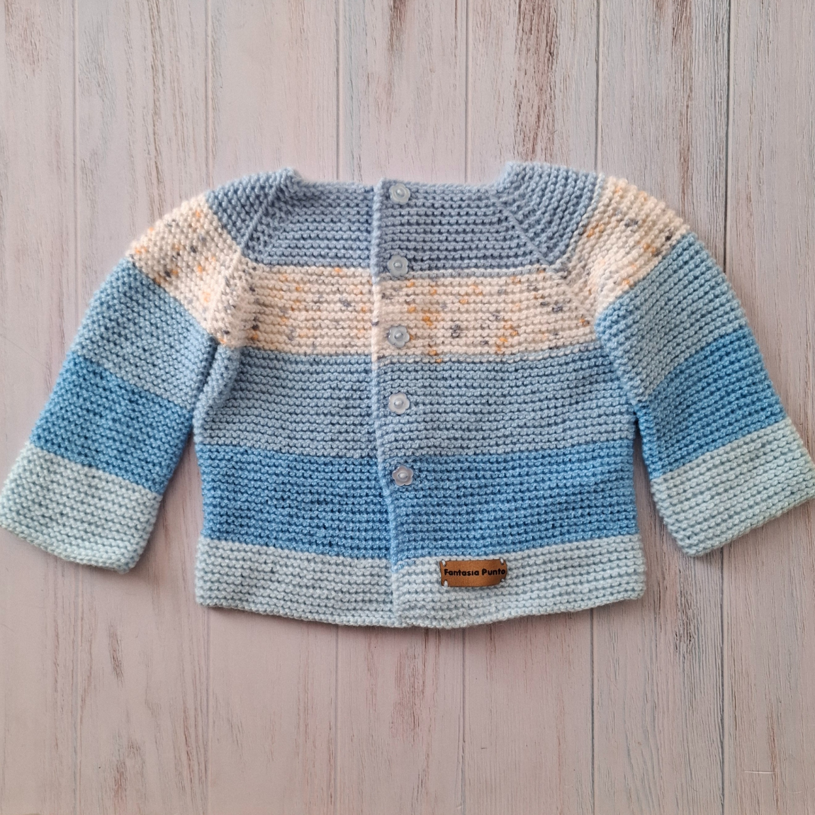 Chaleco celeste/blanco 6-9 meses