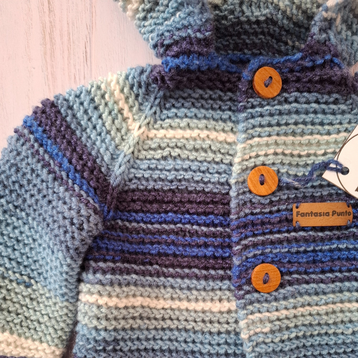 Abrigo con capucha azul 12 meses